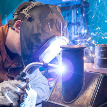 a close-up of a student welding